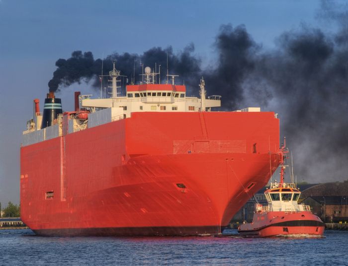 Ship emitting black smoke